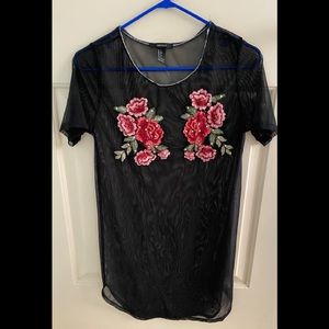 Black mesh dress with appliqués and rhinestones